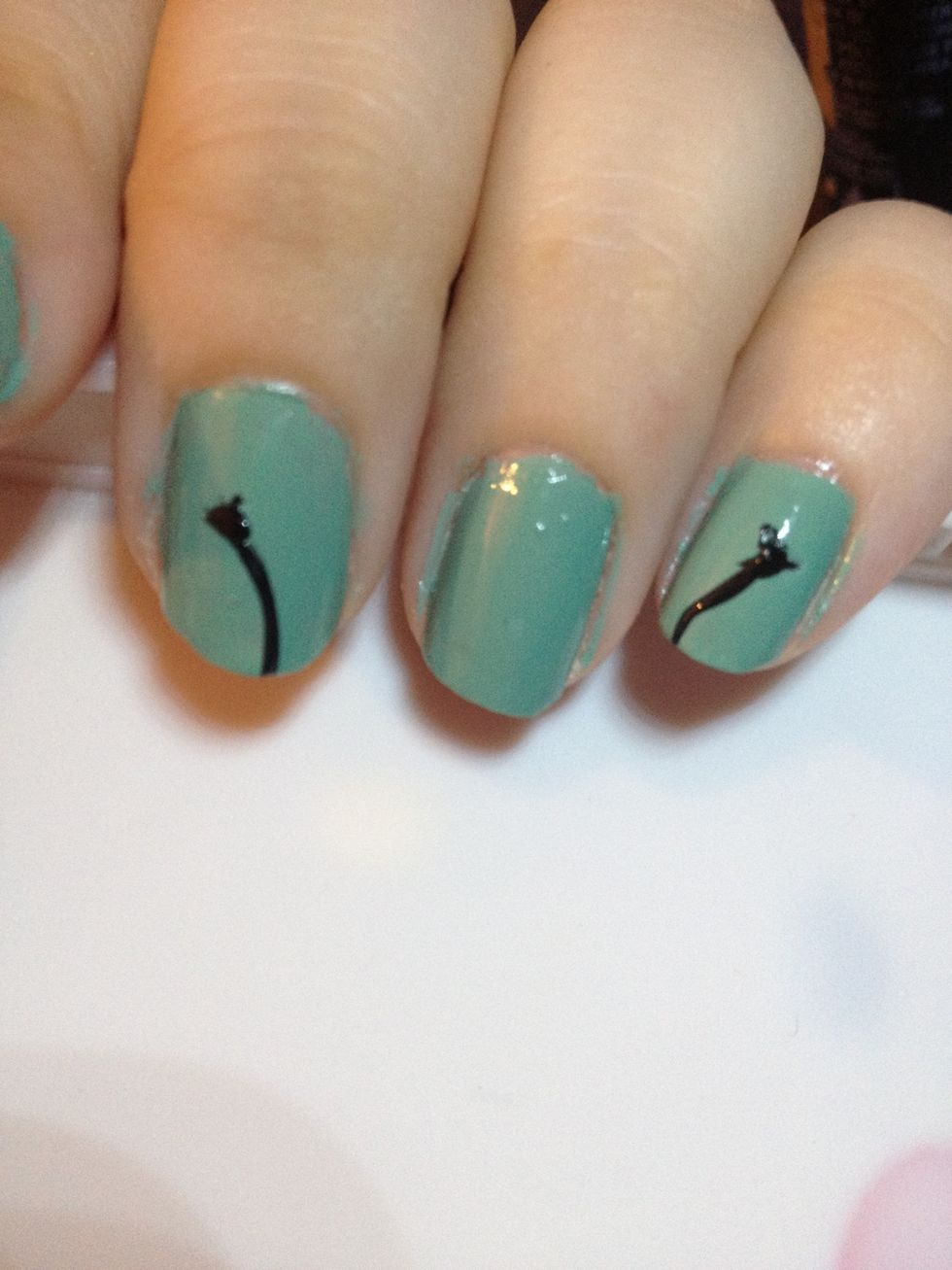 Make two lines facing the opposite direction on your middle finger & pinky. Make an upside down triangle shape for the base of the dandelion