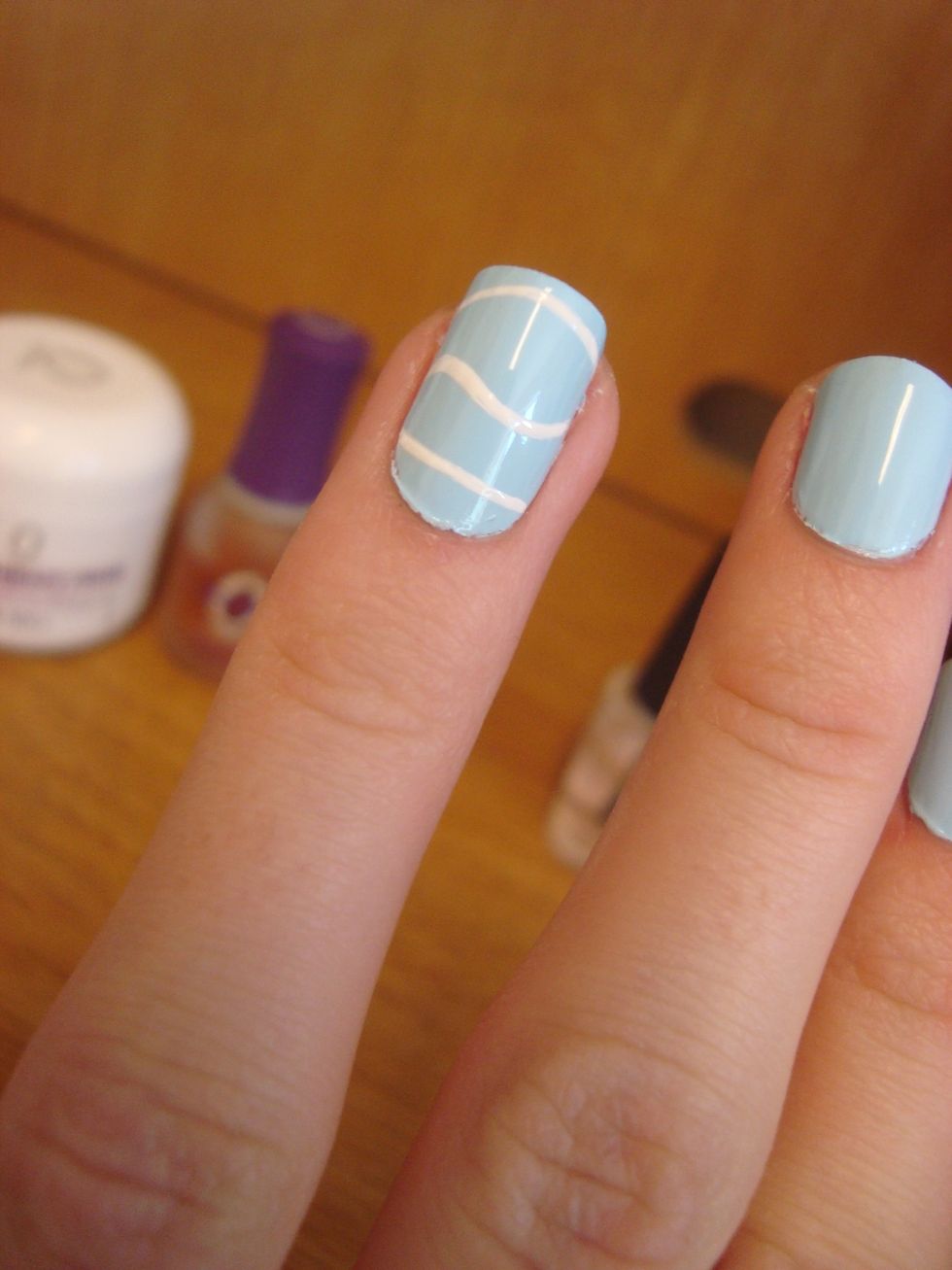 Make two straightish likes on the top and bottom.