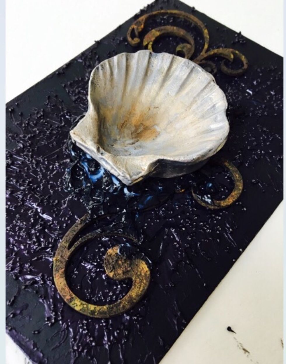 Make up some more base mixture and add the shell. Don\u2019t be afraid to really spread it on thick and bring the mixture up and around the shell.