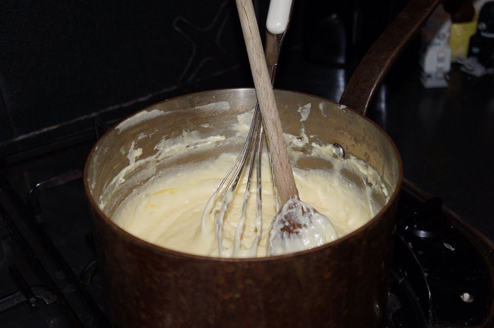 make white sauce 100g of butter let it melt. Add 3 tablespoons of flour and let cook for 3 min. Pure 3 cups of milk. Whisk until it thickens. Take off the heat and grate 200g of Cheddar cheese into it