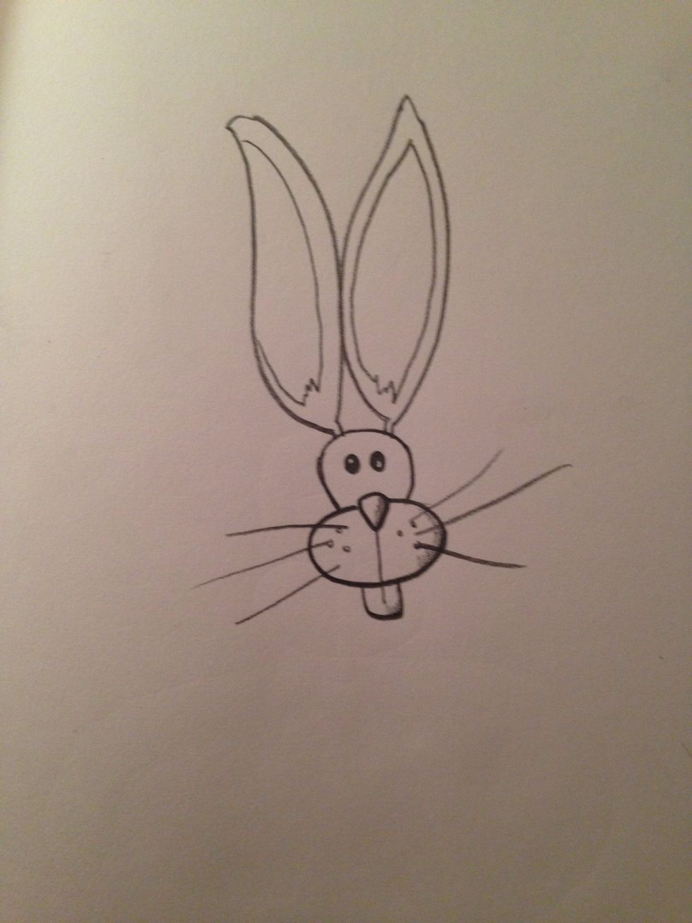 Make your cartoon more whimsical by exaggerating certain features like the ears on this rabbit.