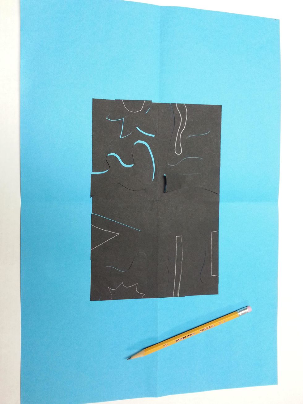 Make your design more interesting! Pick at least 4 of the bigger shapes. Draw a smaller shape inside, making sure to start and end the new shape on the straight edge of the paper.