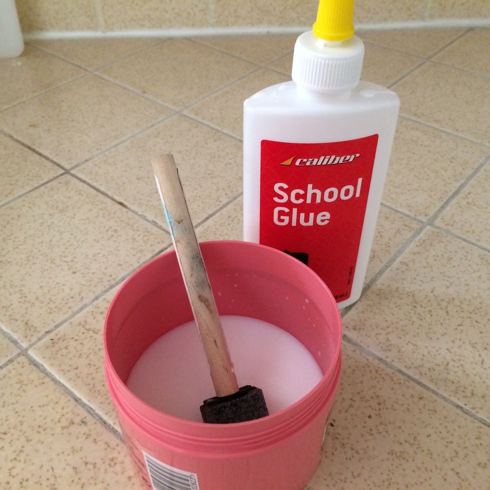 Make your "modge podge" or glue adhesive. Take an old tub or jar and mix 1/3 water and 2/3 school glue (modify depending on the amount of glue adhesive you desire). Stir adhesive with brush.