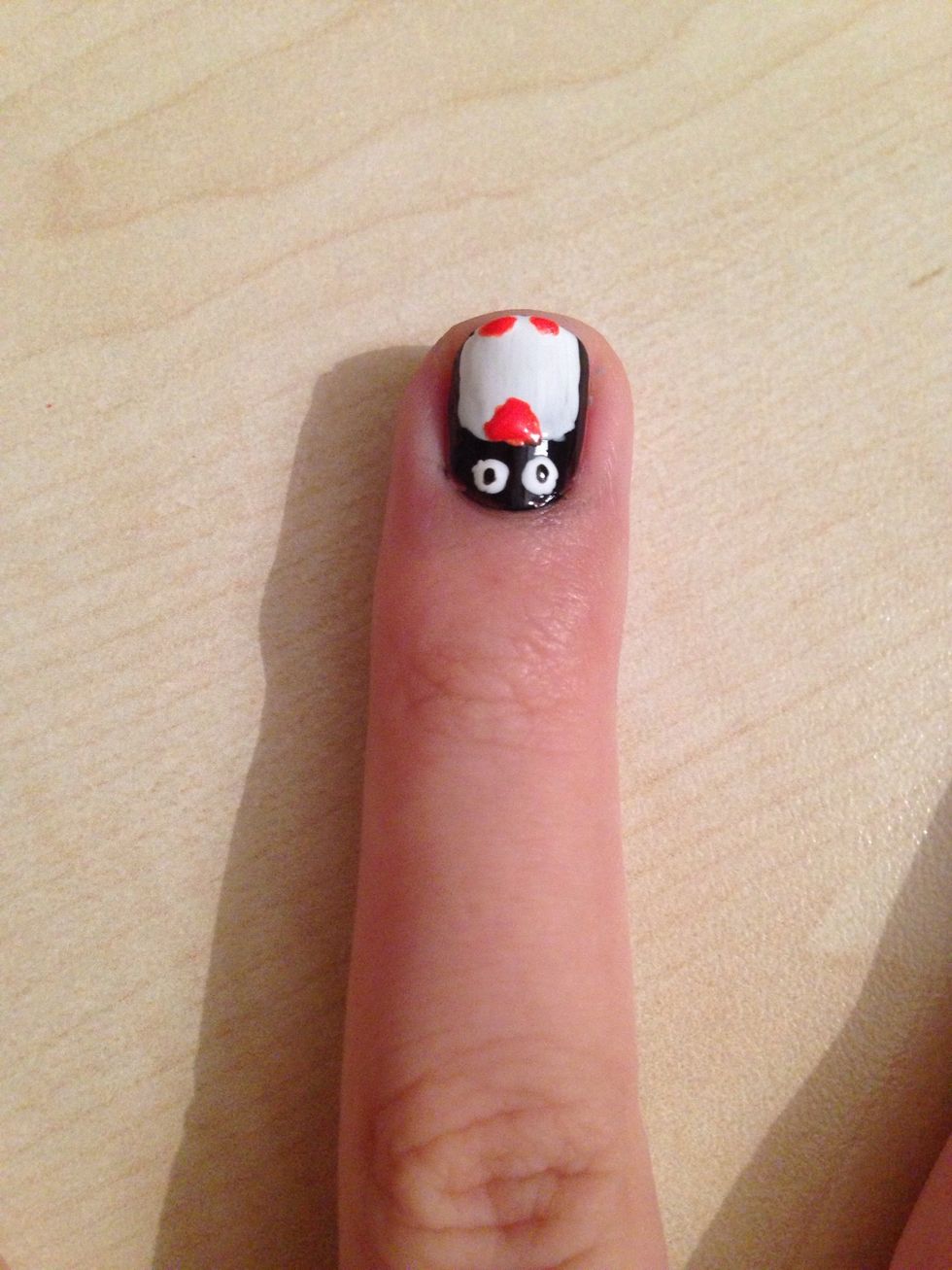 Make your penguin's beak with the orange nailpolish (make a triangle)