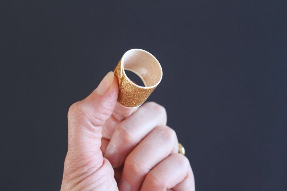 Make your smallest ribbon into a simple tube with the pretty side facing out. Glue or staple it closed.