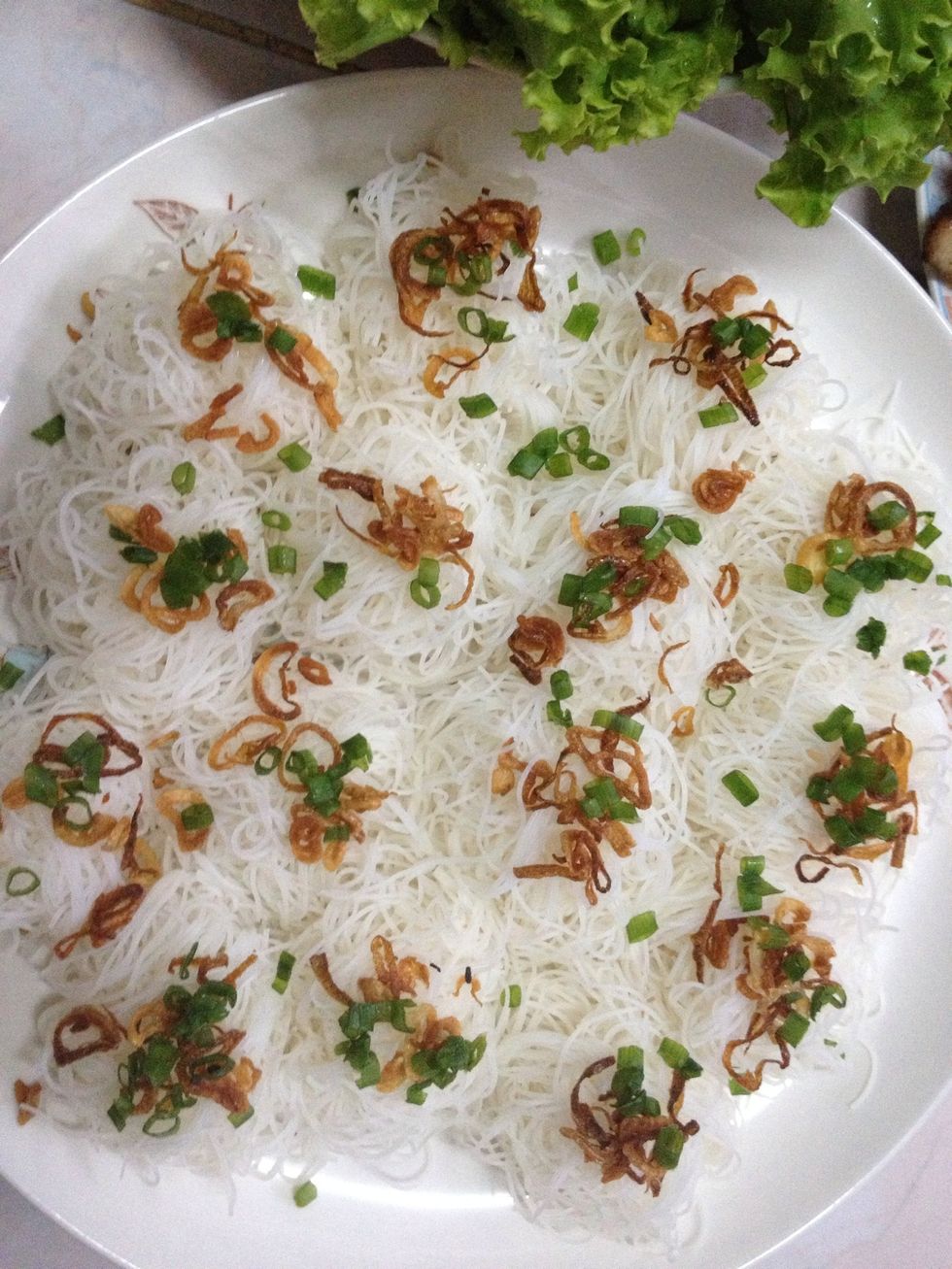 make your steamed rice vermicelli into small portion (like in the picture). then put some fried shallot & spring onion on them