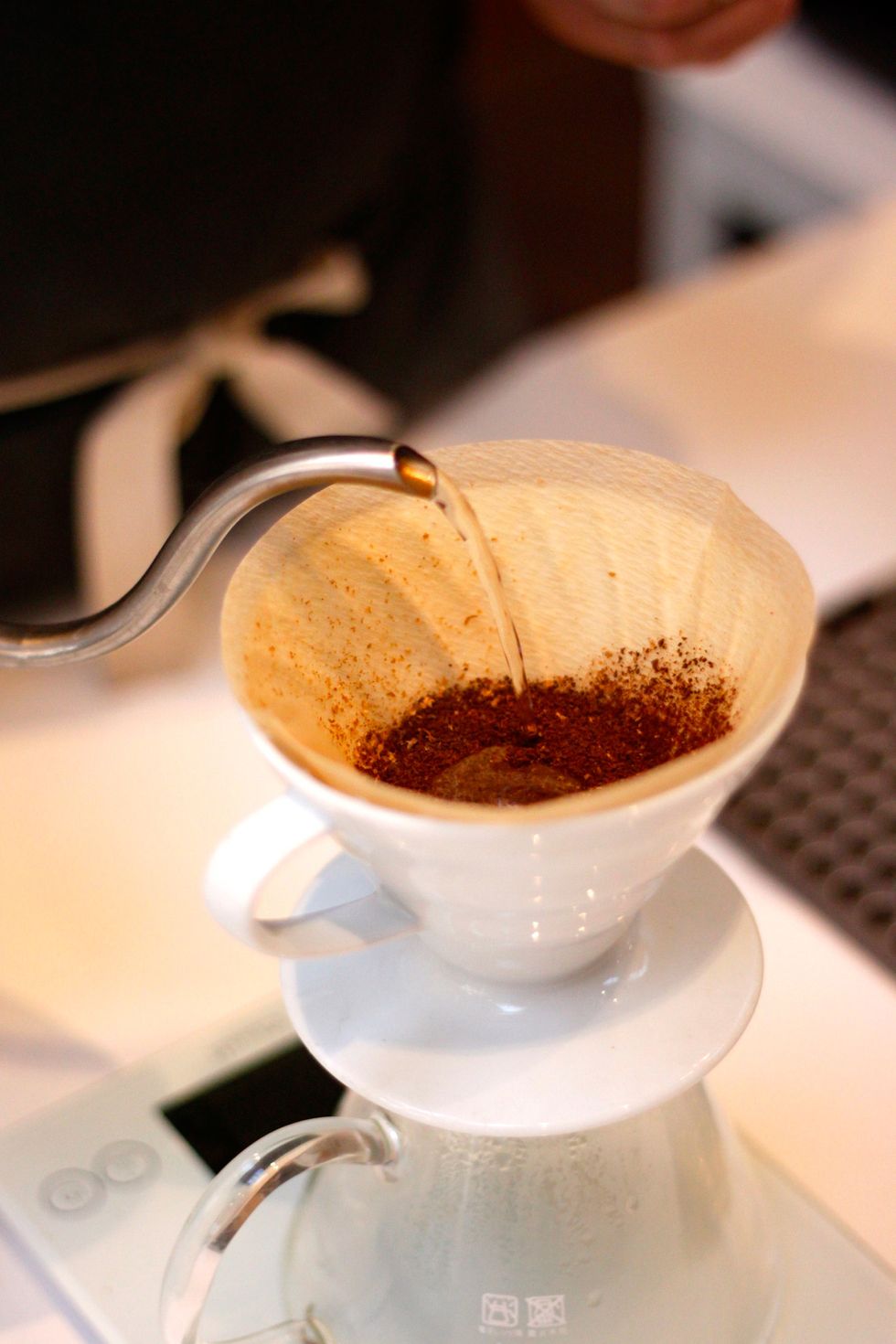 Making sure the beans form an even layer, pour your bloom. This is 60 grams of water.