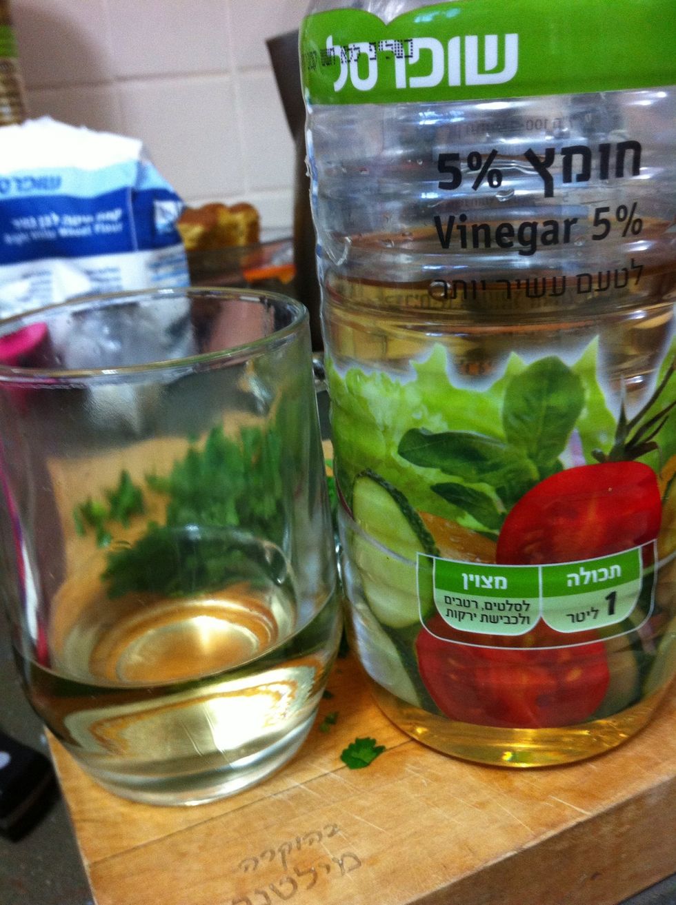 Making the marinade- putting vinegar in a glass