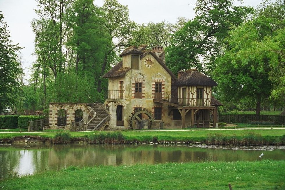 Marie's perfect combination of brick, stone, Tudor, and thatched roofs. This would be my dream home!