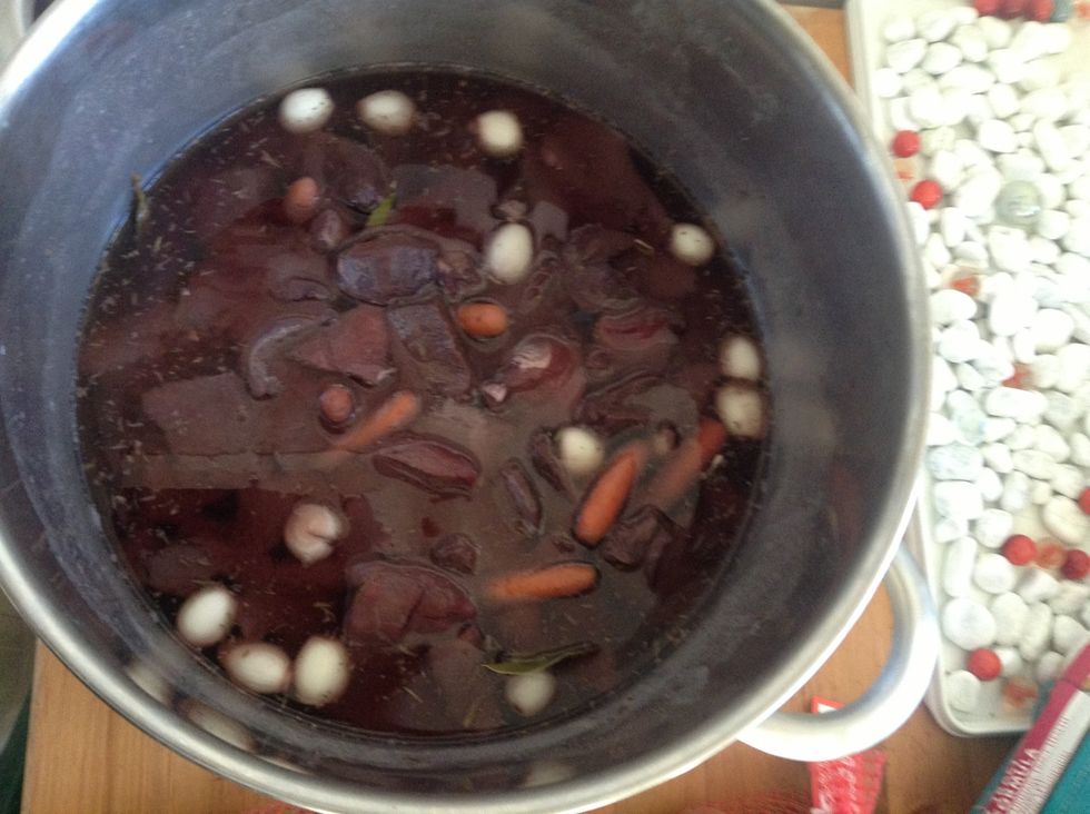 Marinade: cut the meat in pieces and put all ingredients in a pot, fill up with red wine until the meat is swimming :).