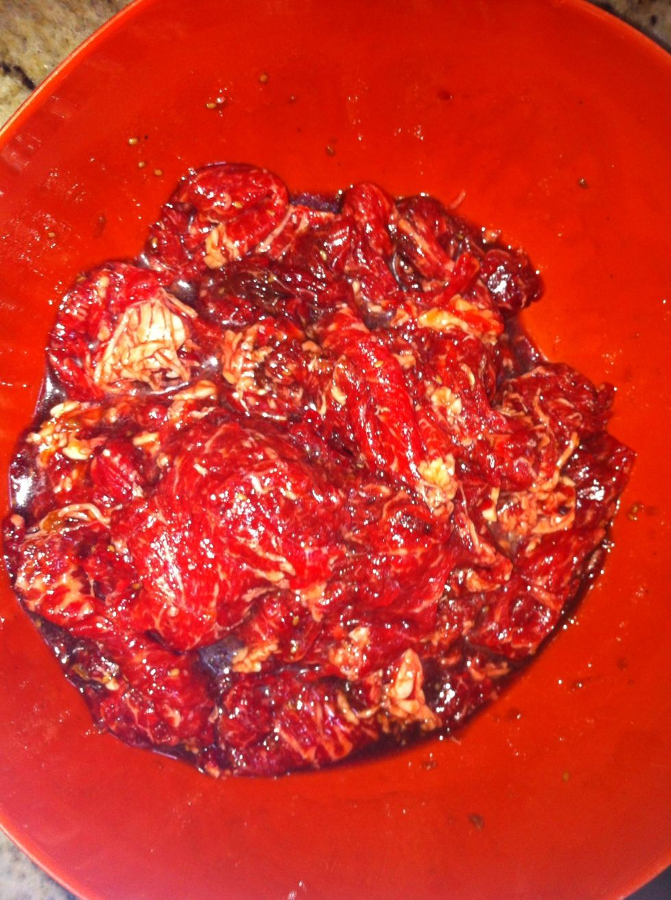Marinate beef in Korean bulgolgi marinade for at least an hour. Cover and set in refrigerator until ready to cook.
