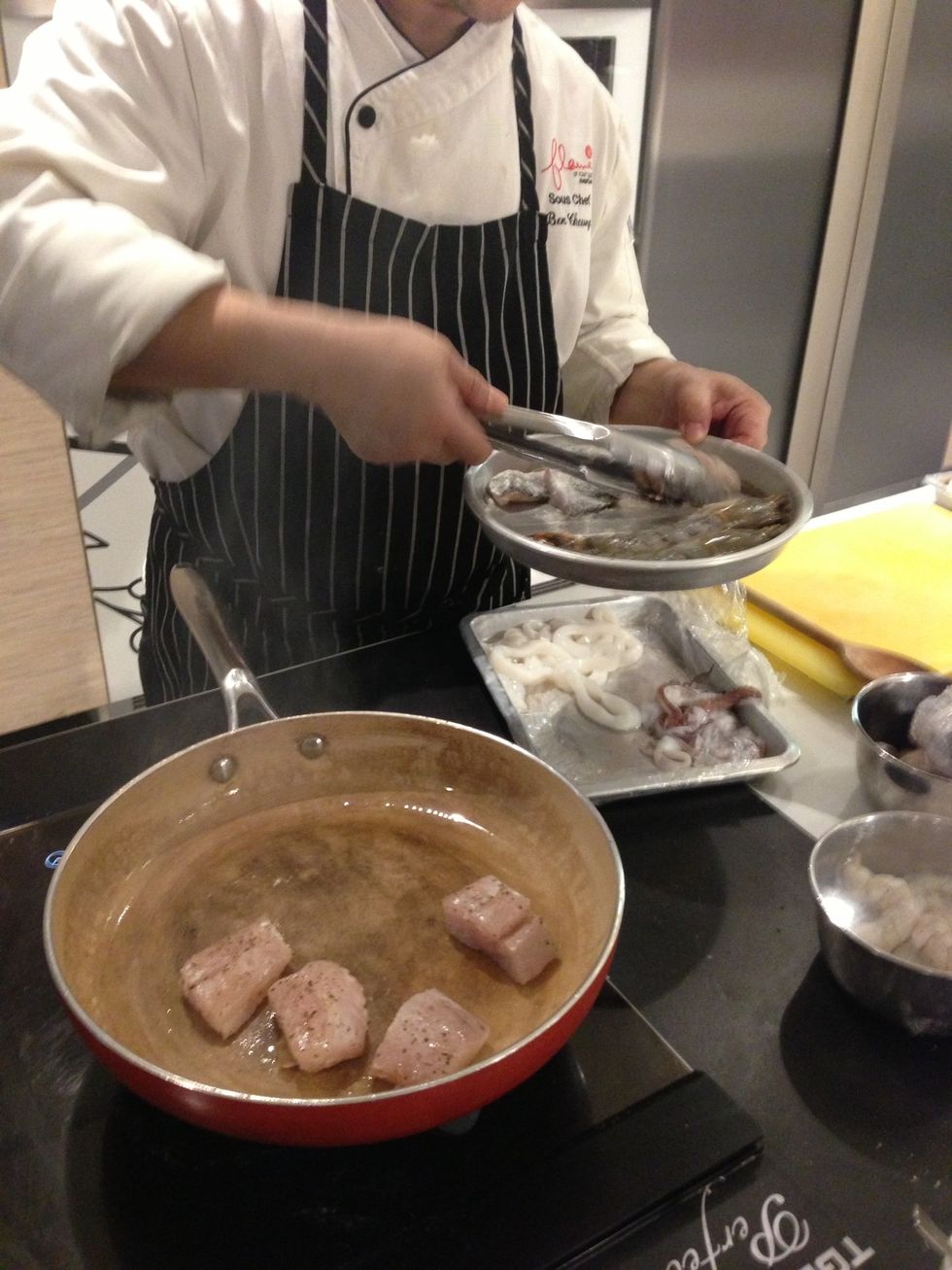 Marinate fish and prawns with salt and pepper. Flour the skin side of the fish. Cook fish and prawn 2-3 minutes each side