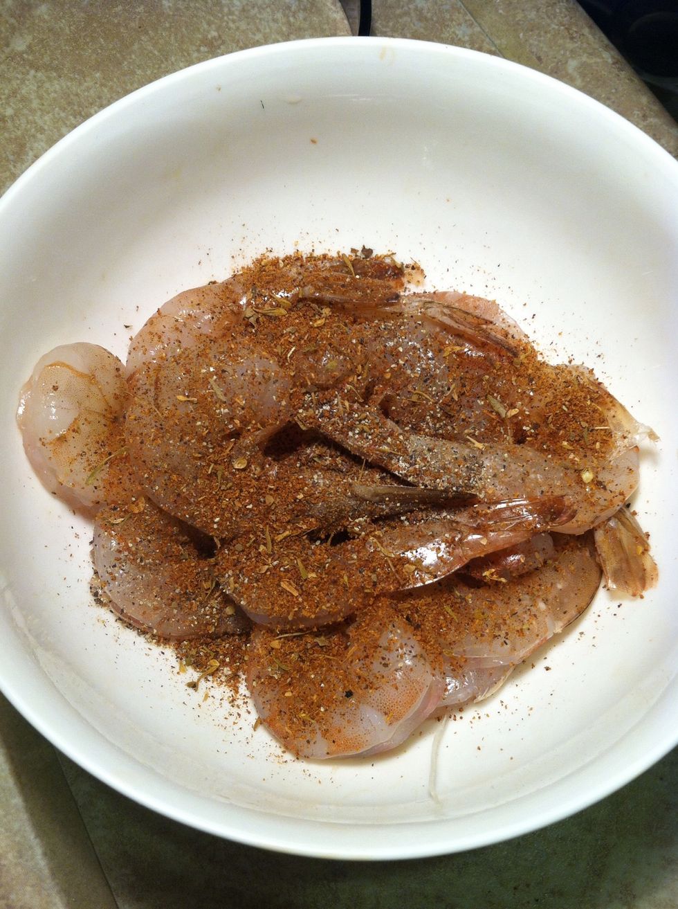 Marinate shrimp in black pepper and Cajun spice