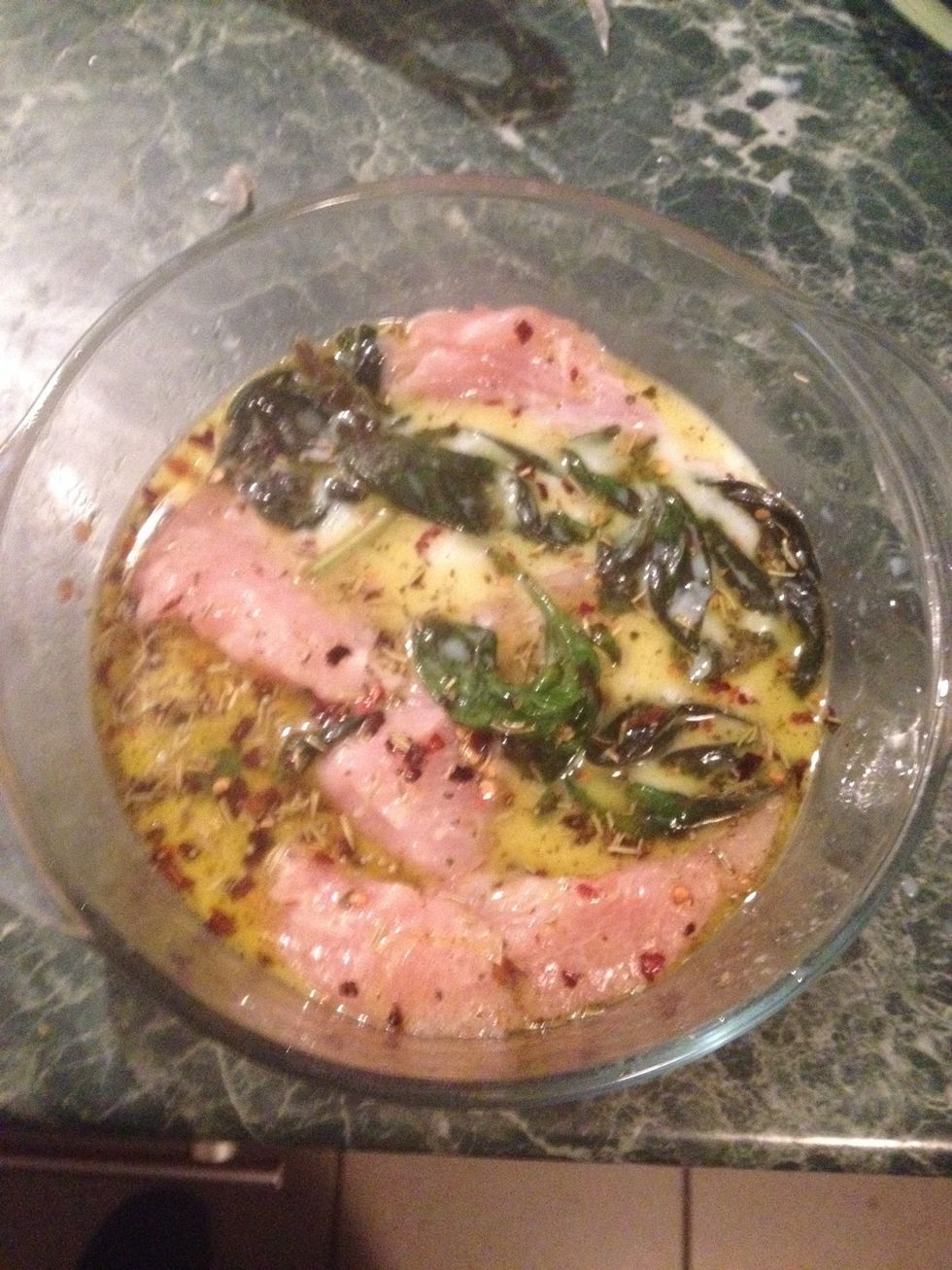 Marinate the chicken with milk, 1/2 lemon, oil,spices, fresh basil for one and half hour