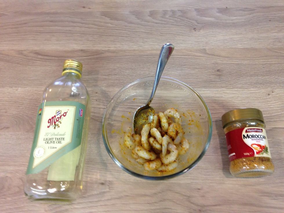 Marinate your prawns with olive oil and Moroccan spice let them sit while you cut up Parsley spring onions and Garlic