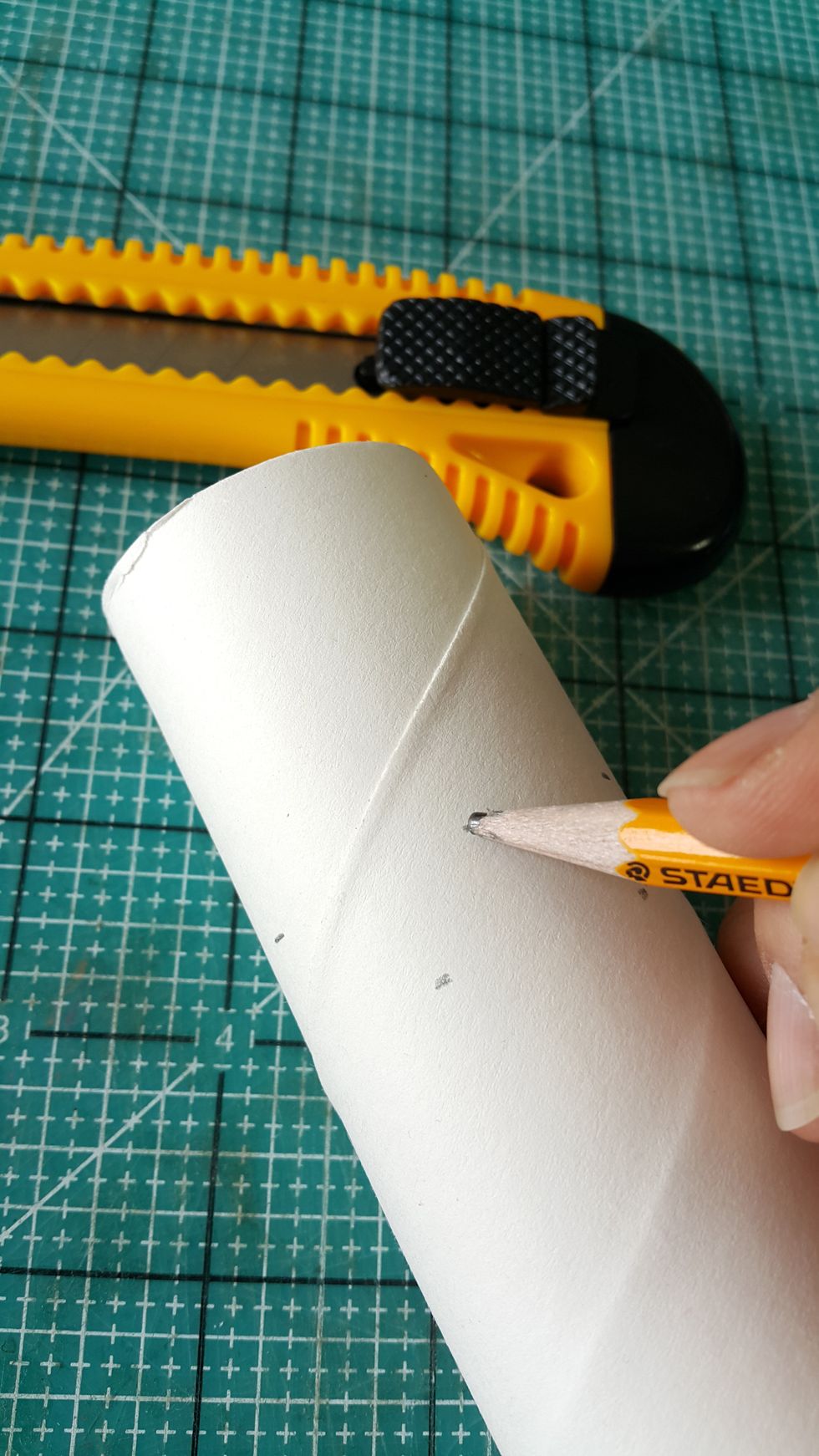 Mark 2-1/2" round the toilet tissue roll