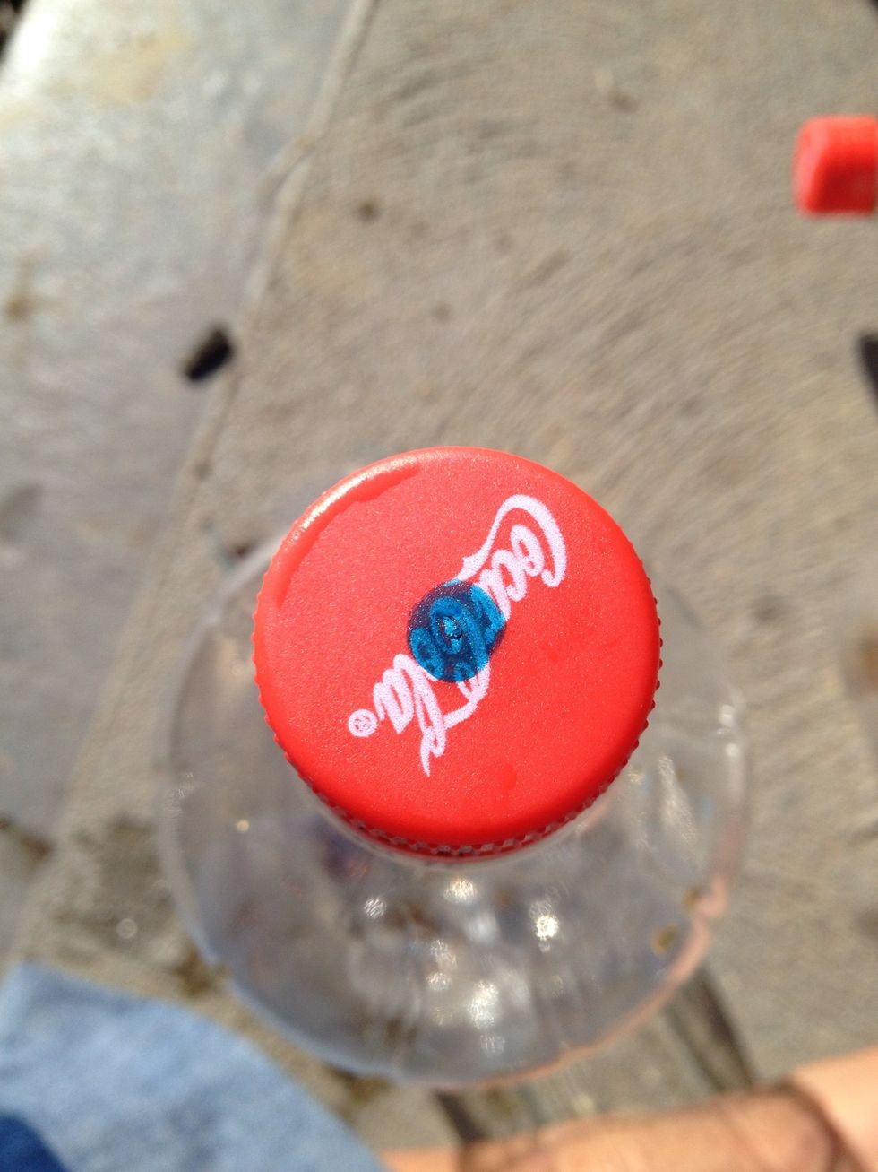 Mark a hole in the lid centre for drainage