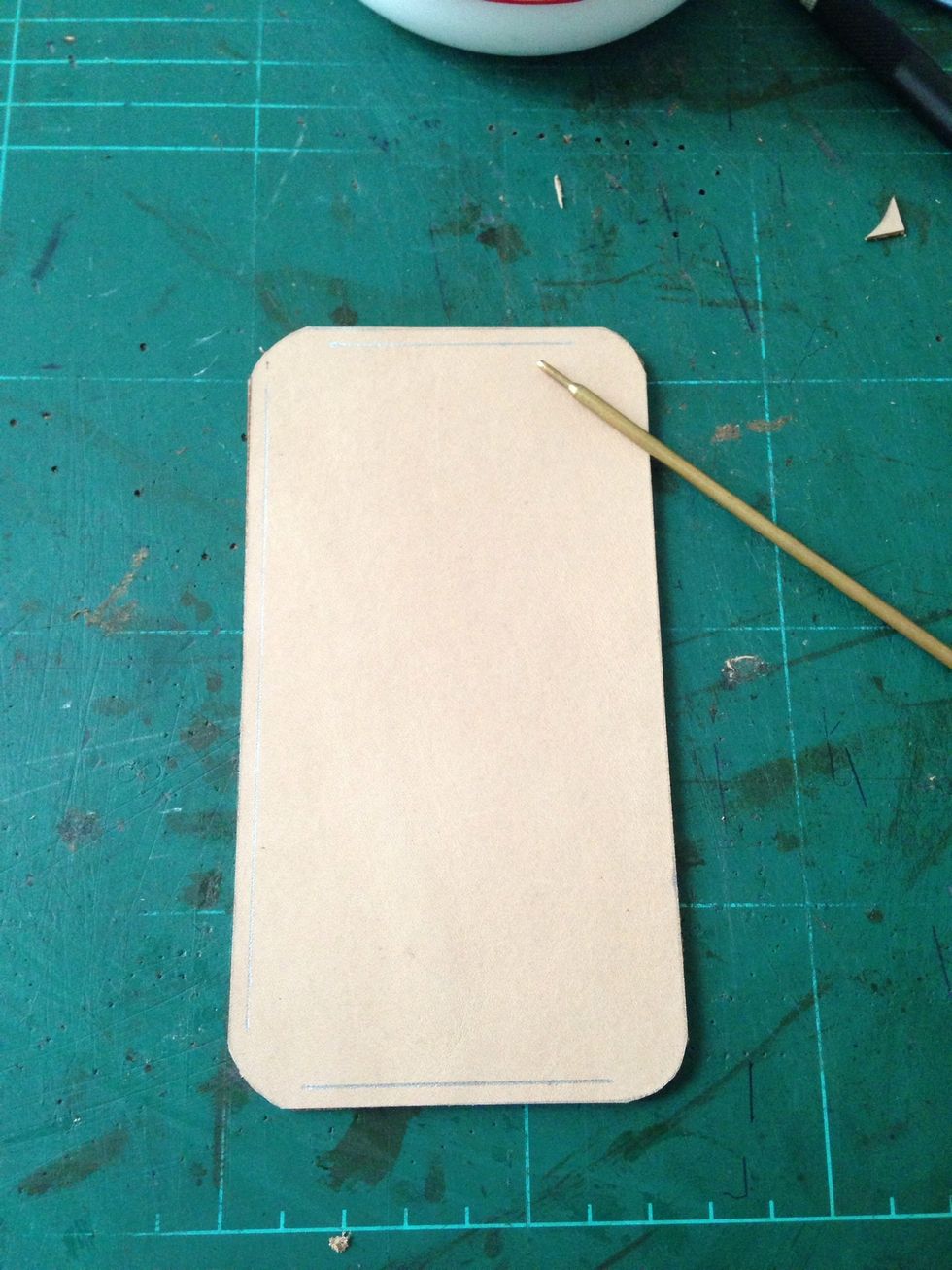 Mark a line about 2.5-3mm from the edge on each side.. It is to marking where the stitching will go