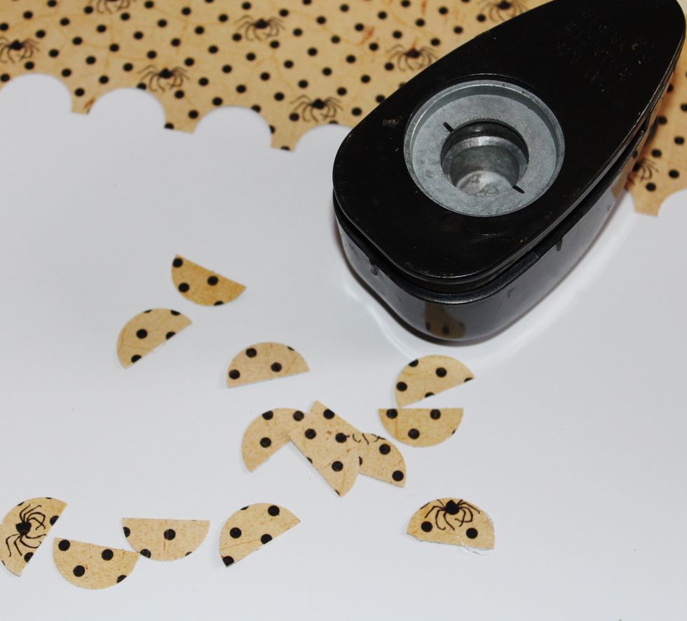 Mark circle punch 1/2 way with Sharpie. Punch 1/2 circles from pattern paper.