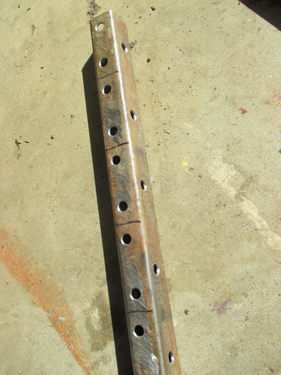 Mark/drill 1/4" holes 1 1/2 " apart on each 2 1/2" segment, drill 1/4" holes at side center of each. De-burr each hole. Saw segments apart. Best to drill all the holes with it as one long piece.