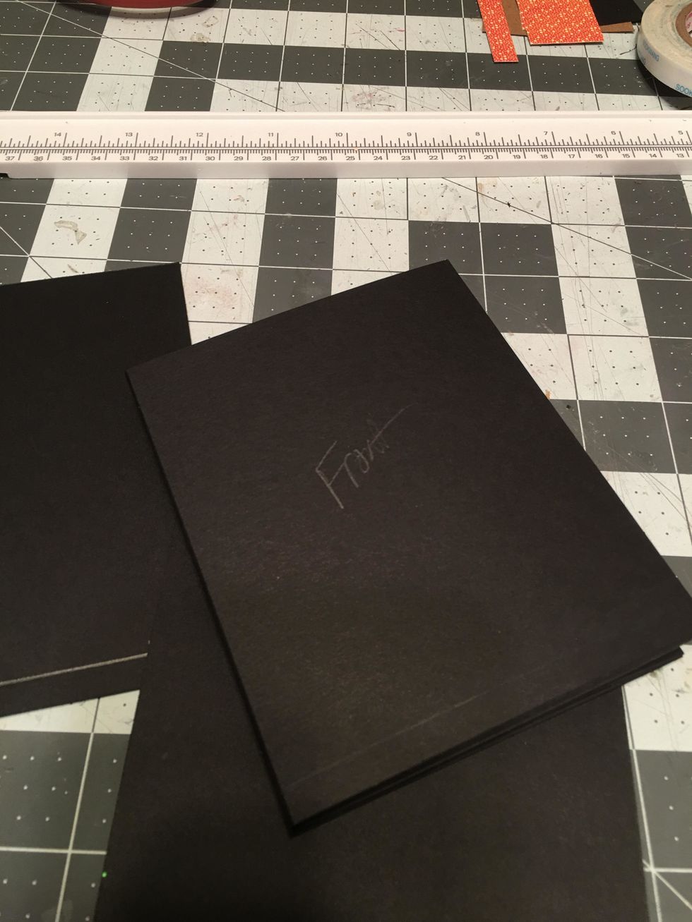 Mark "front" with pencil on the side you want to be the front of your album pages.