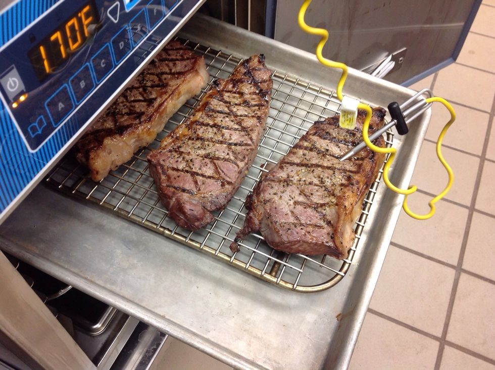 Mark steaks on grill (optional) probe with remote thermometer and place in cook and hold unit in hold mode at 170F (77C).