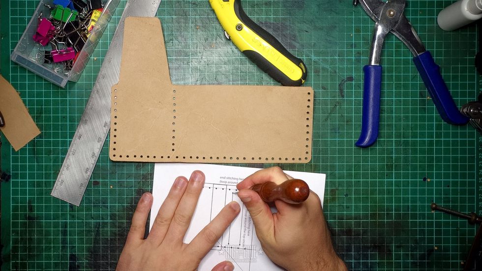 Mark the card slots. Be careful to not get it too close to the main stitching holes punched in the previous step