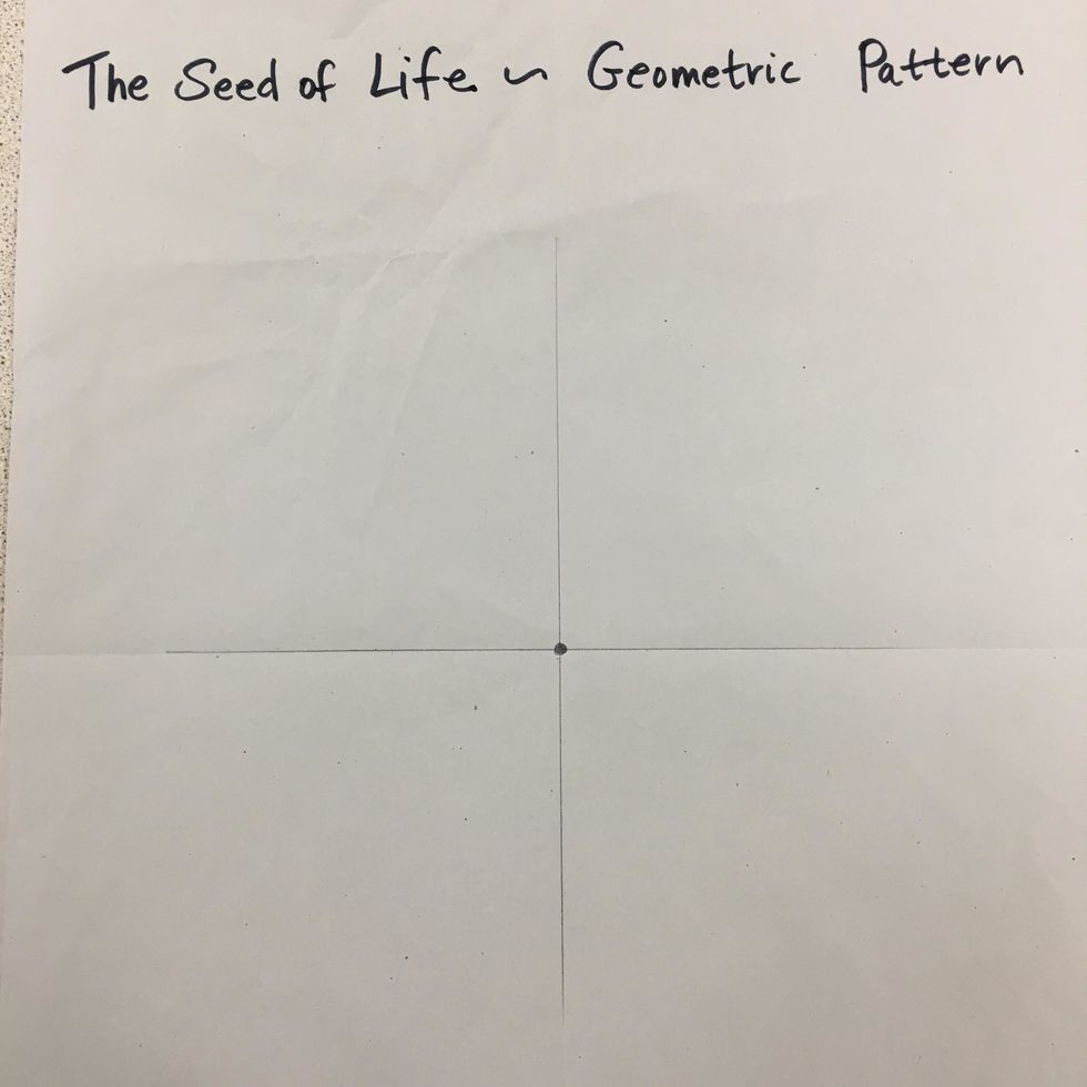 Mark the center of the paper with a dot using a pencil and use a ruler to mark the folds.