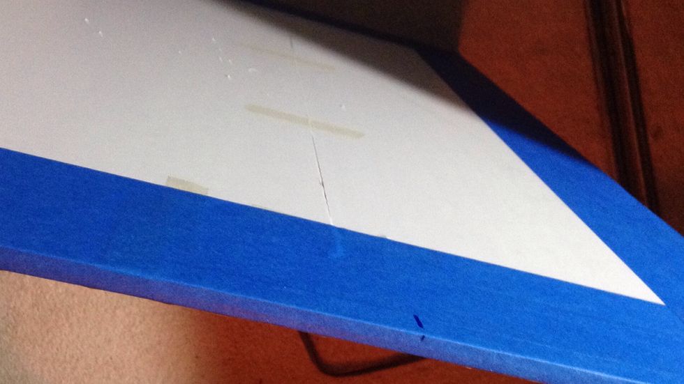 Mark the distance from the screws on the back of your board to where you'd like to hang the hap.