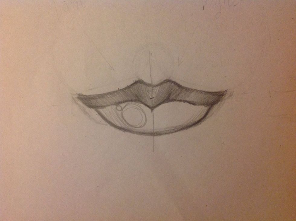 Mark the line of the lower lip with circular strokes at the ends.