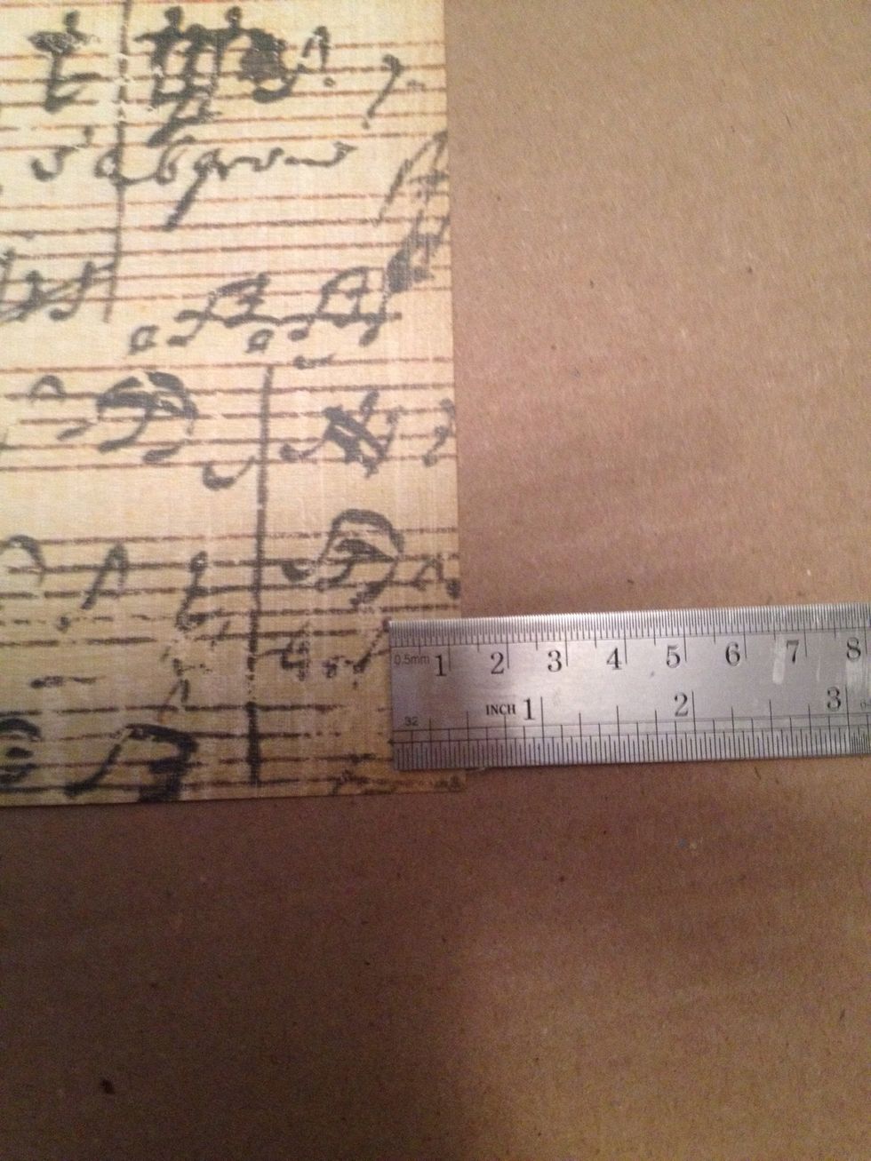 Mark the paper at 1/2 inch on two edges of a side.