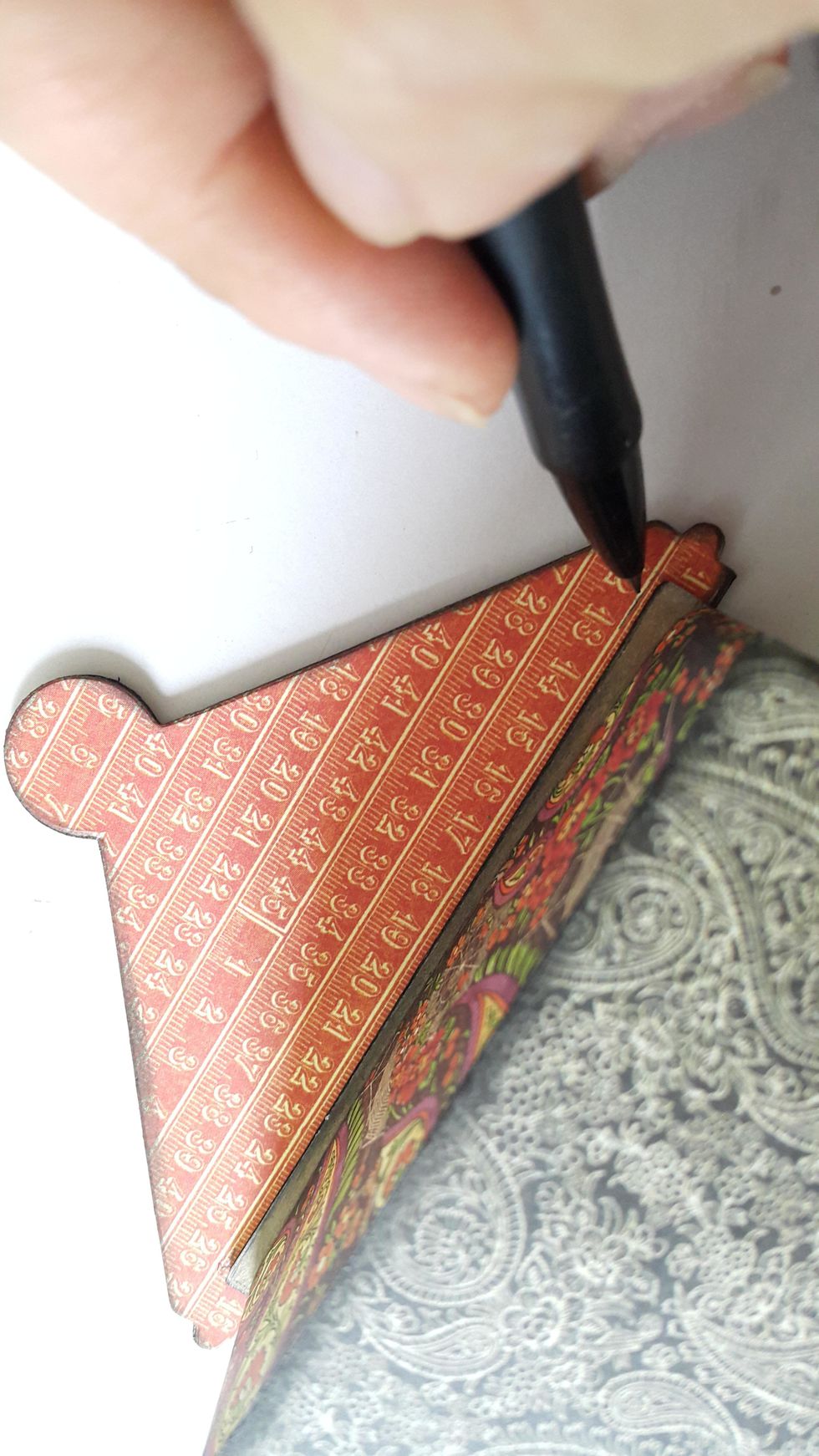 Mark the position of the box on the top, where you will stick on the lid holder