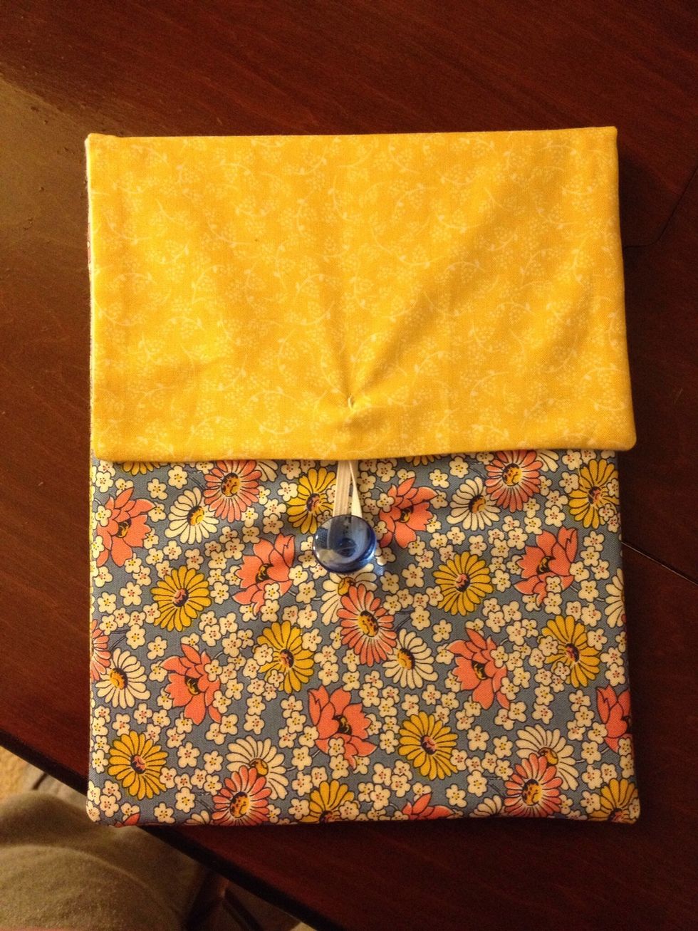 Mark where you would like the button to go and sew in place. Remember to stretch the elastic a little to find the best place for the button.