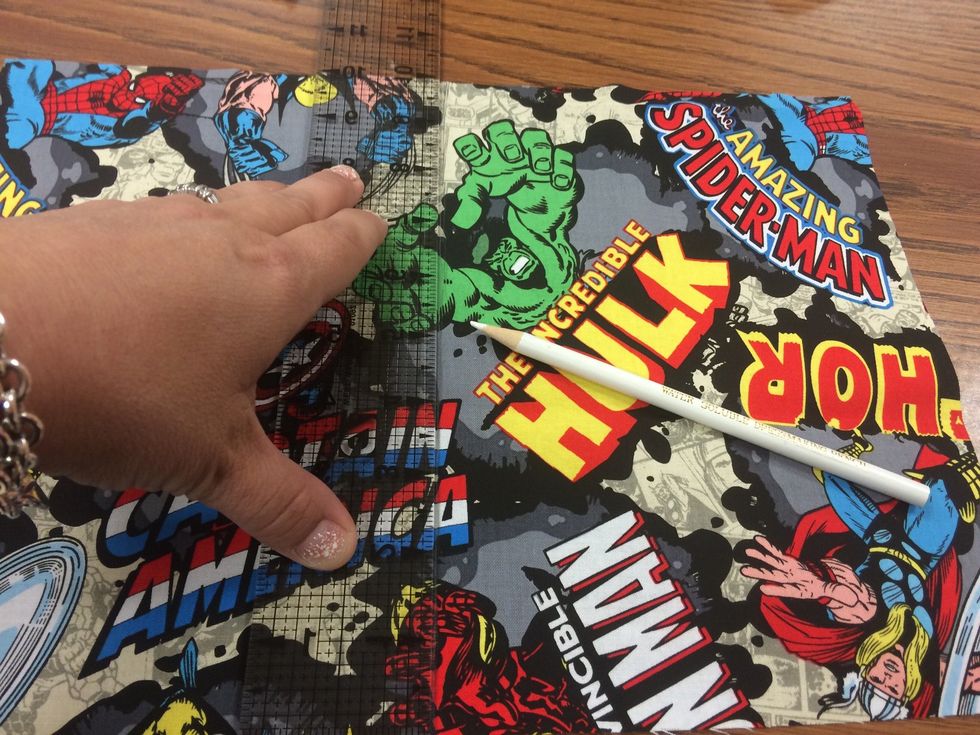 Mark with a ruler and pencil - exact line in the center of the fabric (you will be dividing your pocket in half)