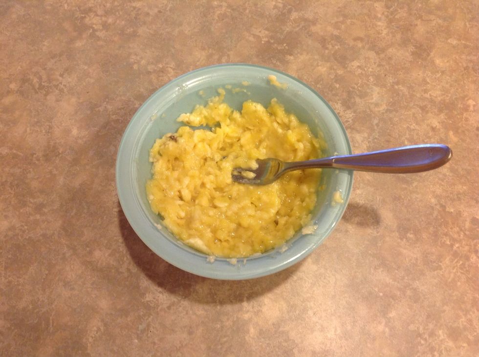 Mash bananas with a fork.