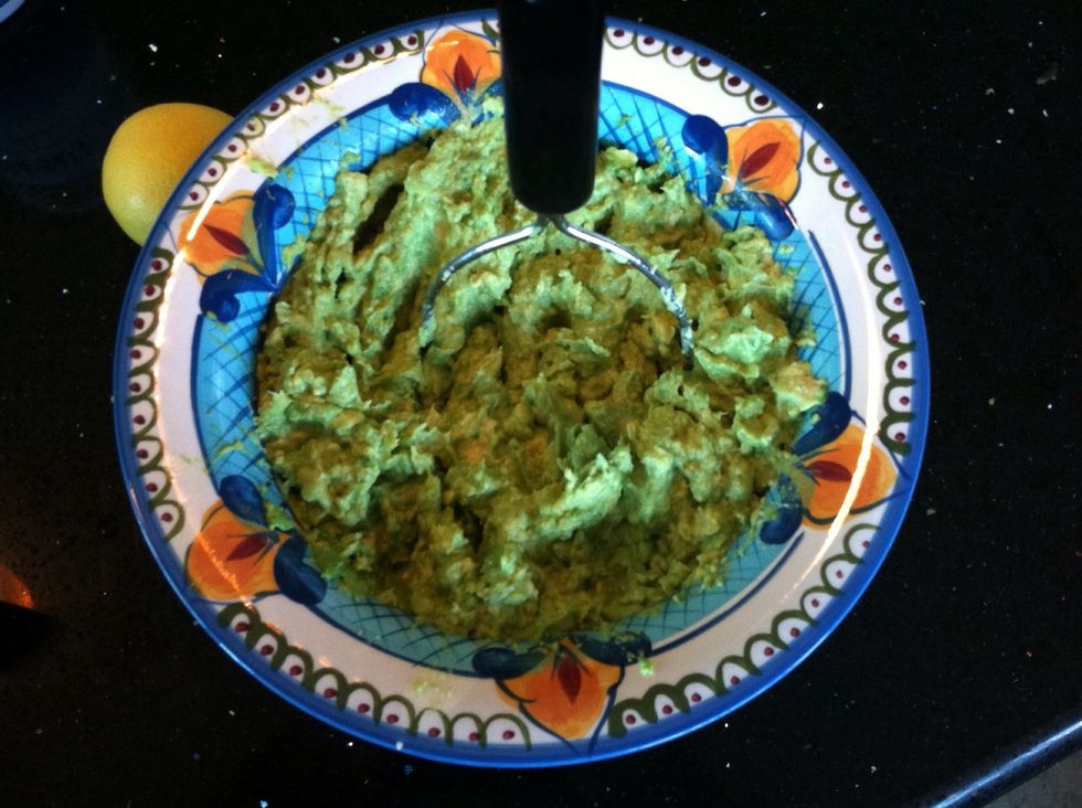 Mash the avocado with a potato masher or a fork.