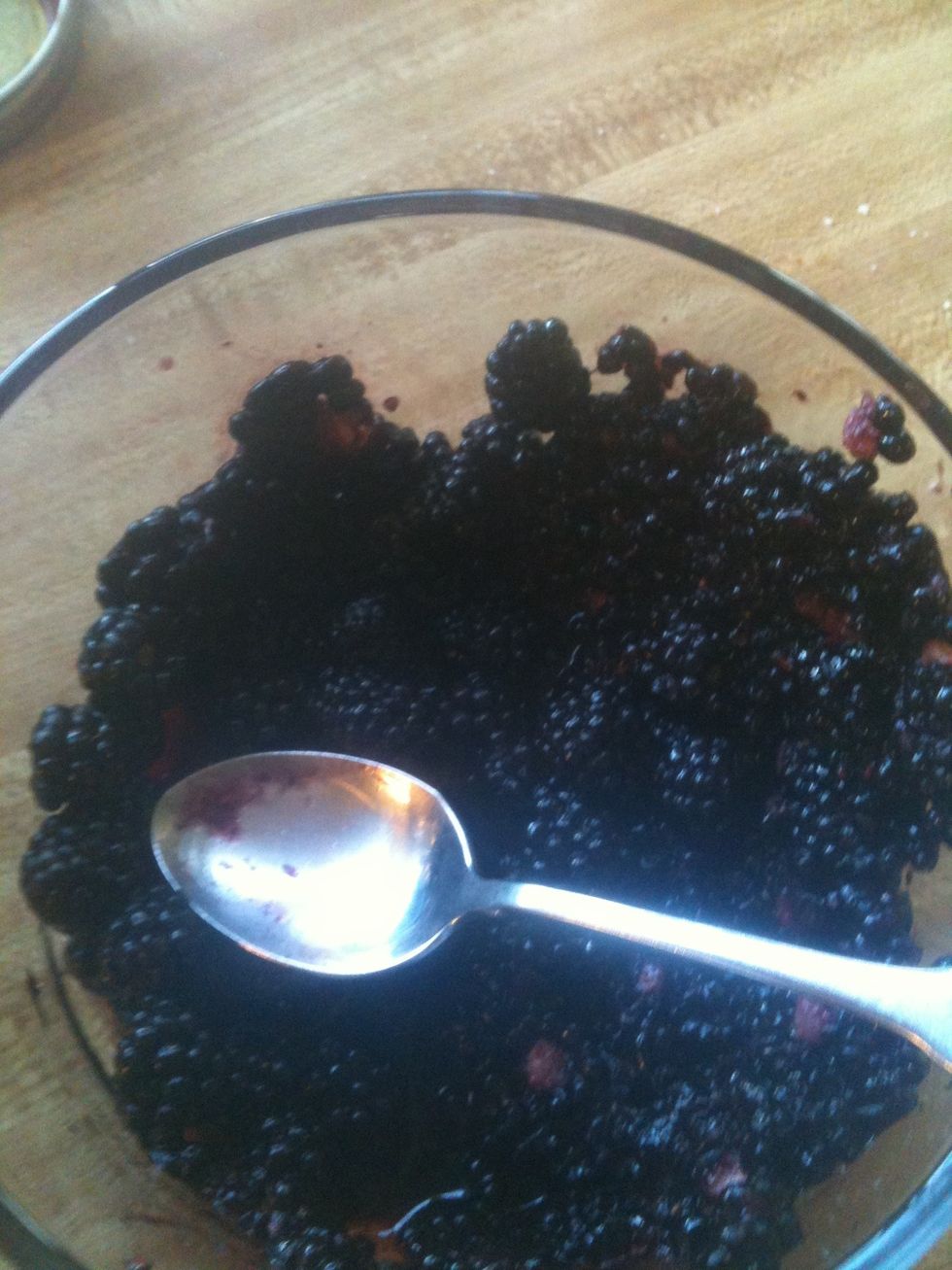 Mash the blackberries using a spoon