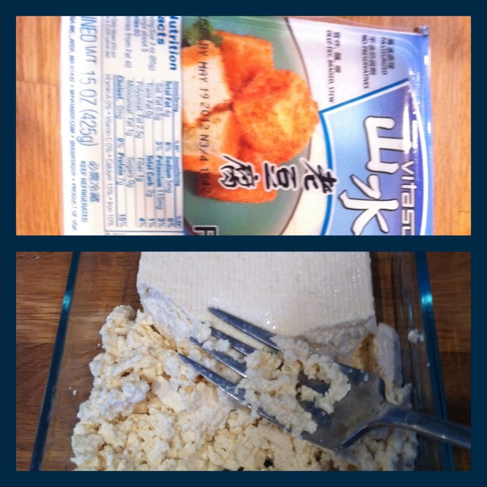 Mash the firm tofu with a fork.