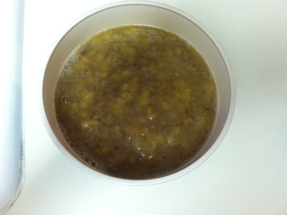 Mash the overripe bananas with your hands. Measure one cup of mashed bananas and add two tablespoons of orange juice to prevent browning.