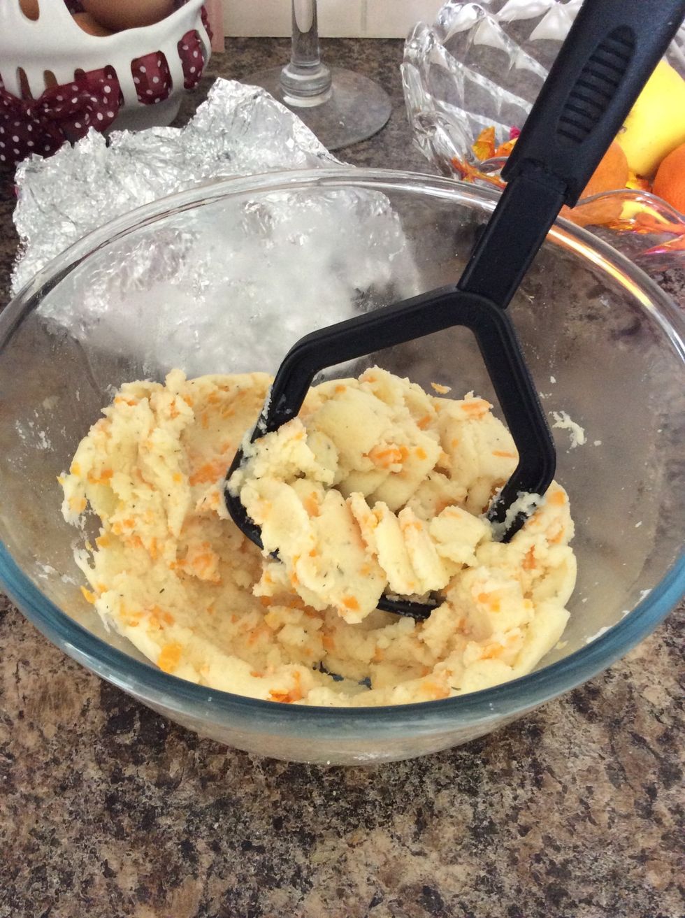 Mash the potato in the bowl with your fillings. I chose to mash it with milk, butter, mixed herbs, salt and pepper and cheese. You could use things like sour milk, bacon, spring onions etc