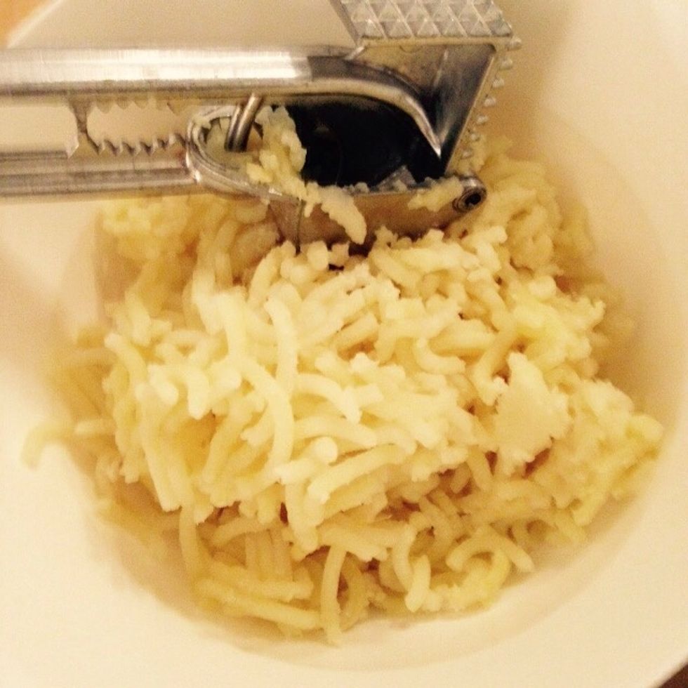 Mash the potatoes into a bowl
