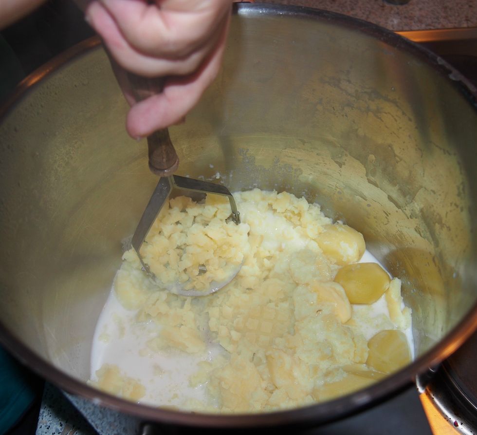 Mash them while adding milk until it's a thick soup.