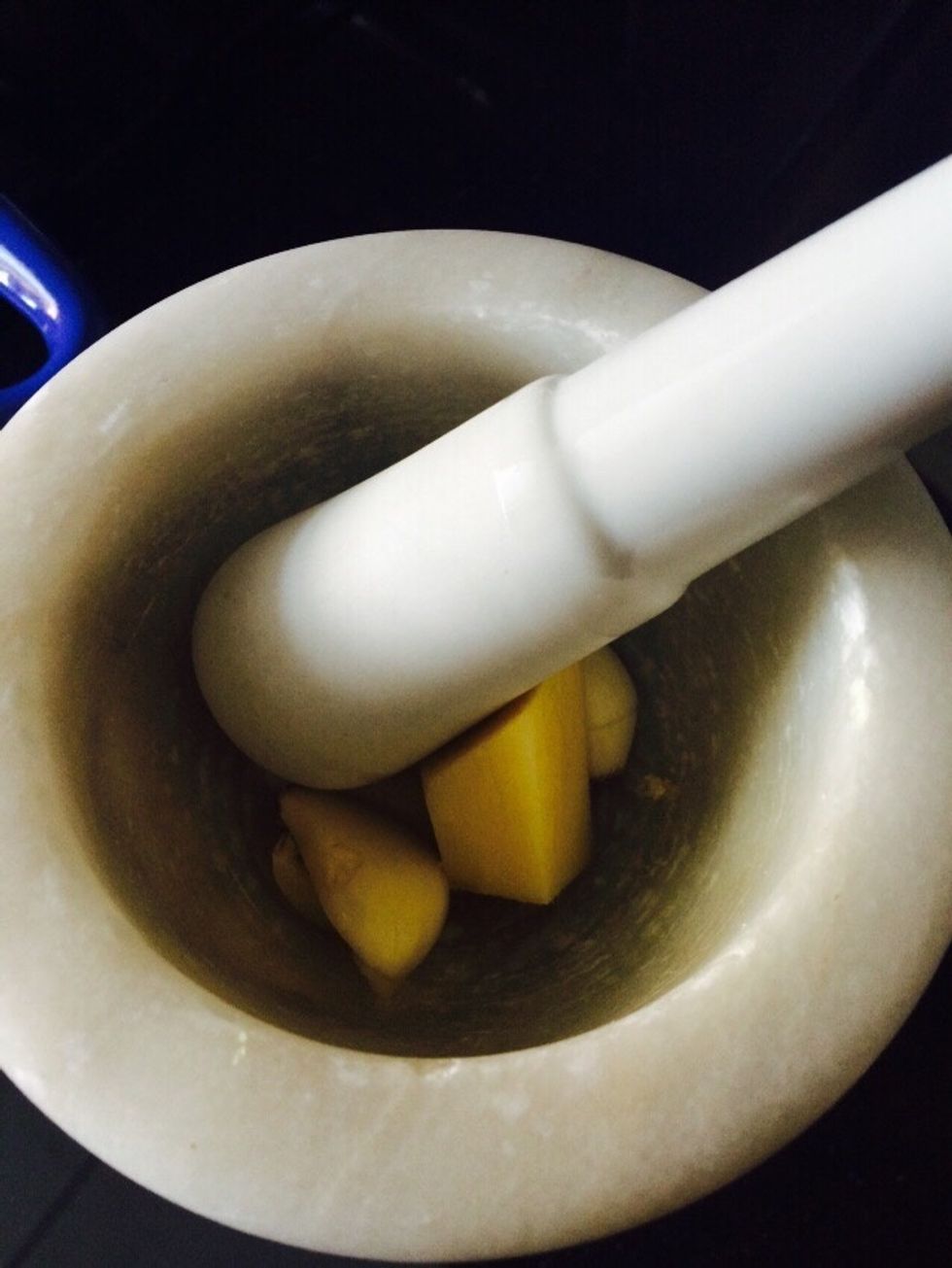 mash up 3 cloves or garlic and one inch of ginger and add to the pan