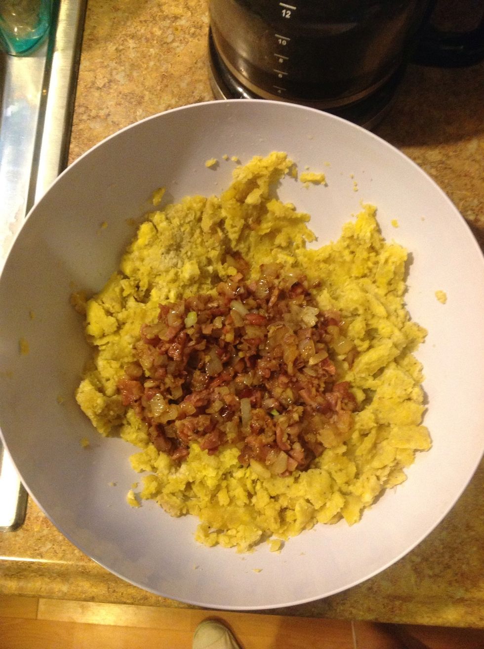 Mash your plantains and add your saut\u00e9ed mixture