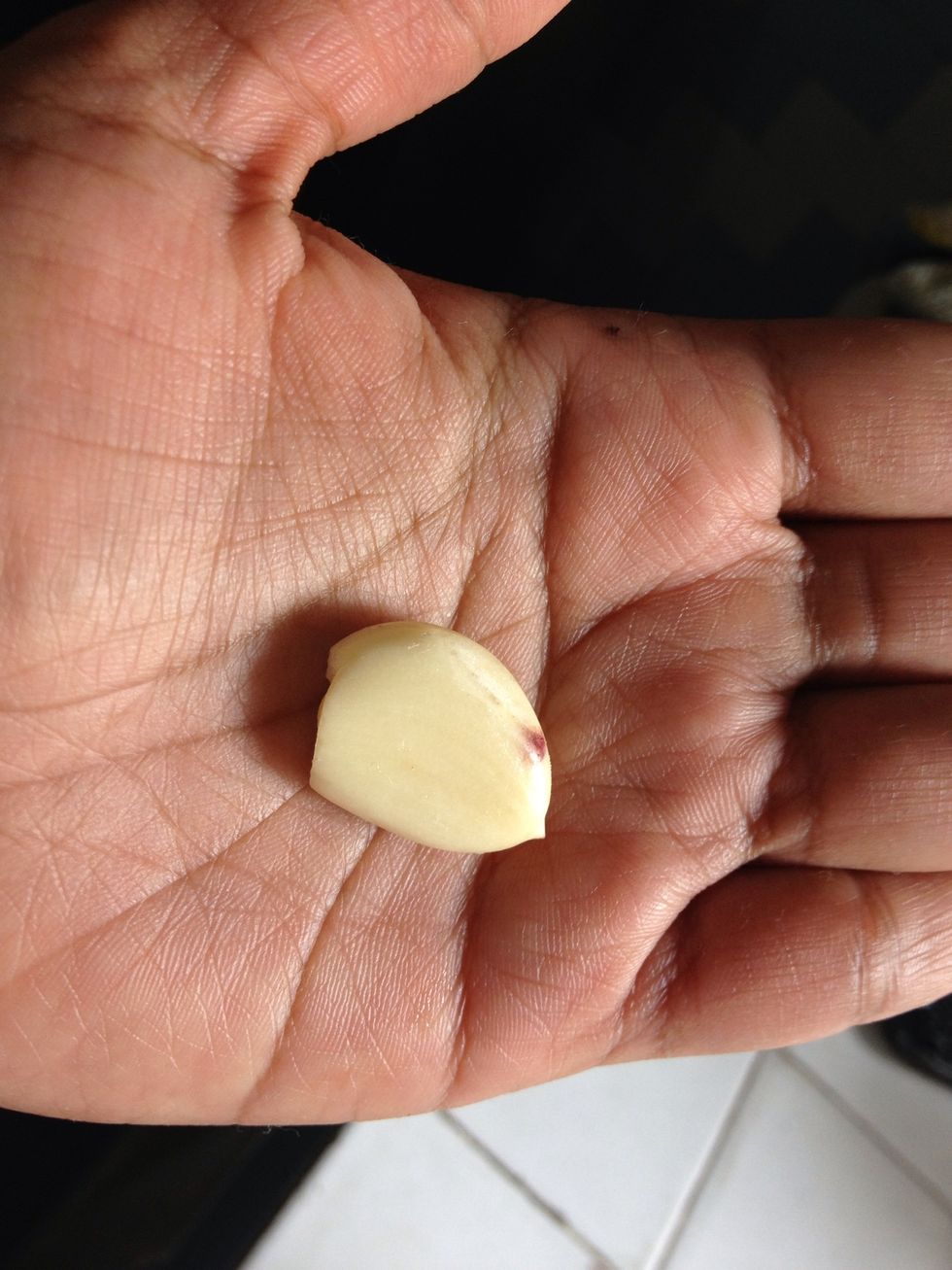 Mashed 1 clove of garlic using mortar and pestle
