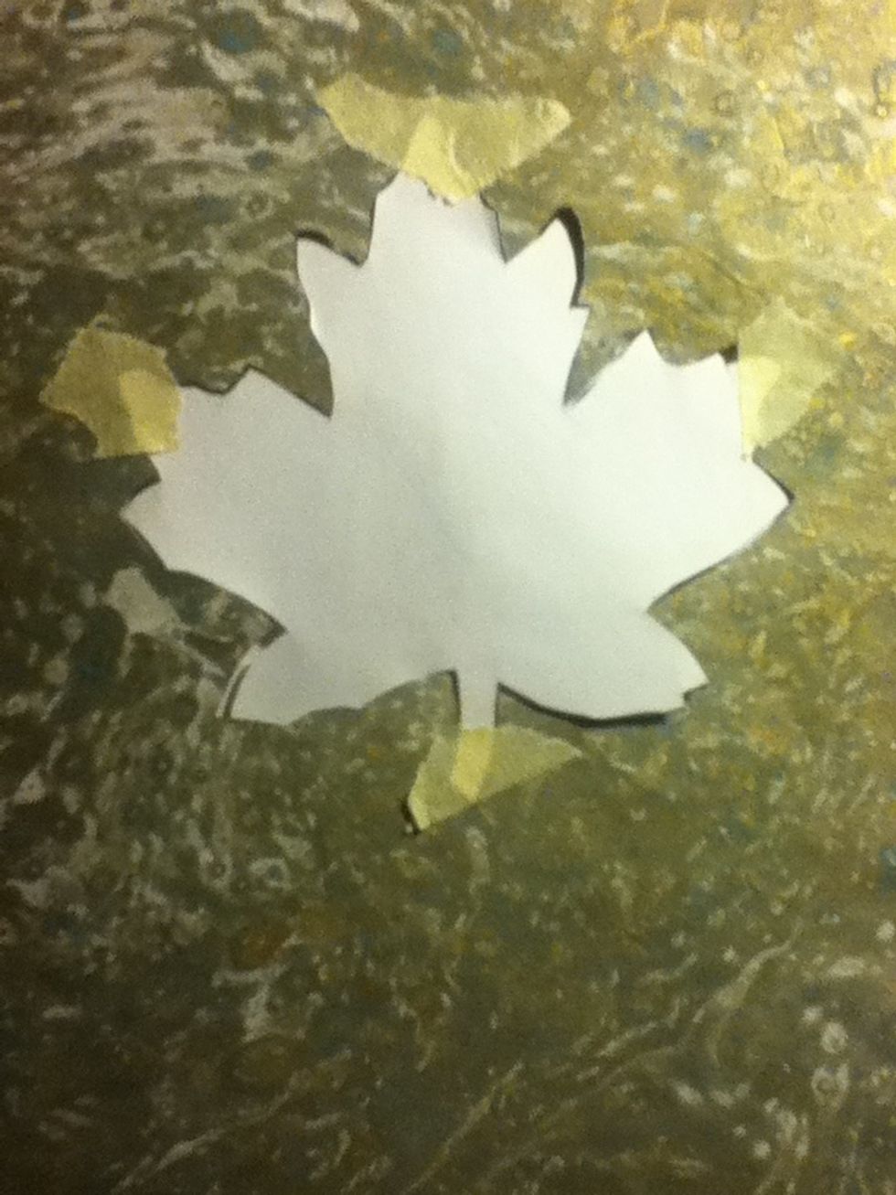 Masking tape it down, it's best if you don't use sticky tape, because masking tape won't tear when you take it off