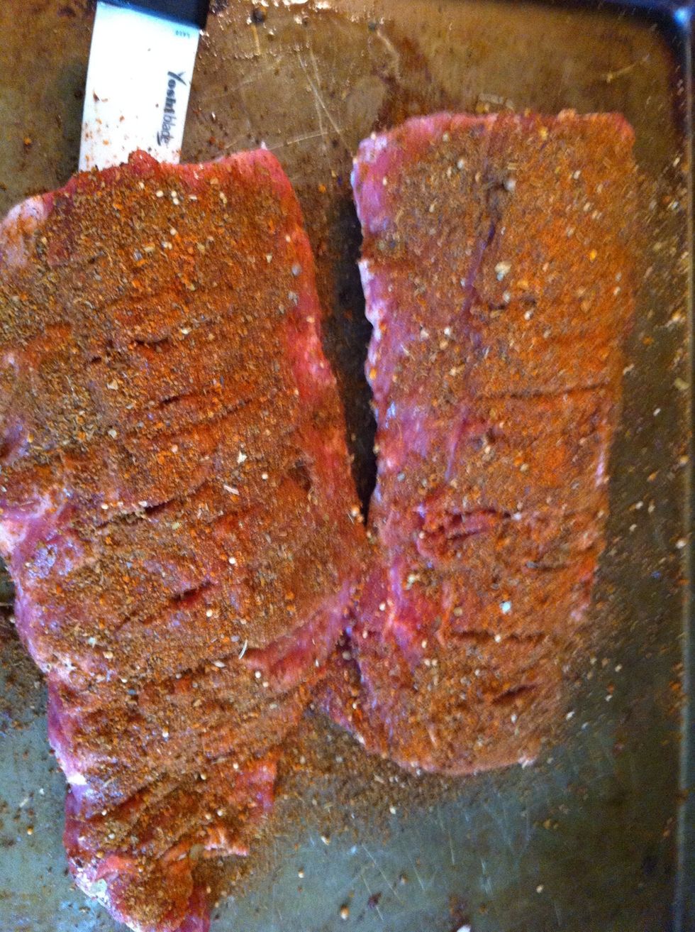 Massage some BBQ rub (recipe to come in a separate guide) onto the ribs (front and back)