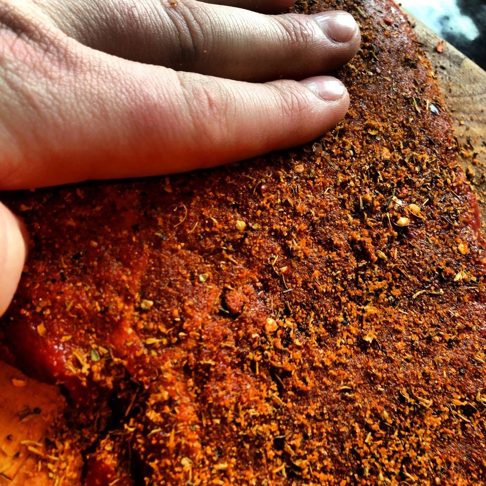 Massage the steak until it is golden brown and evenly coated. The thicker the coating, the hotter and spicier it will be.