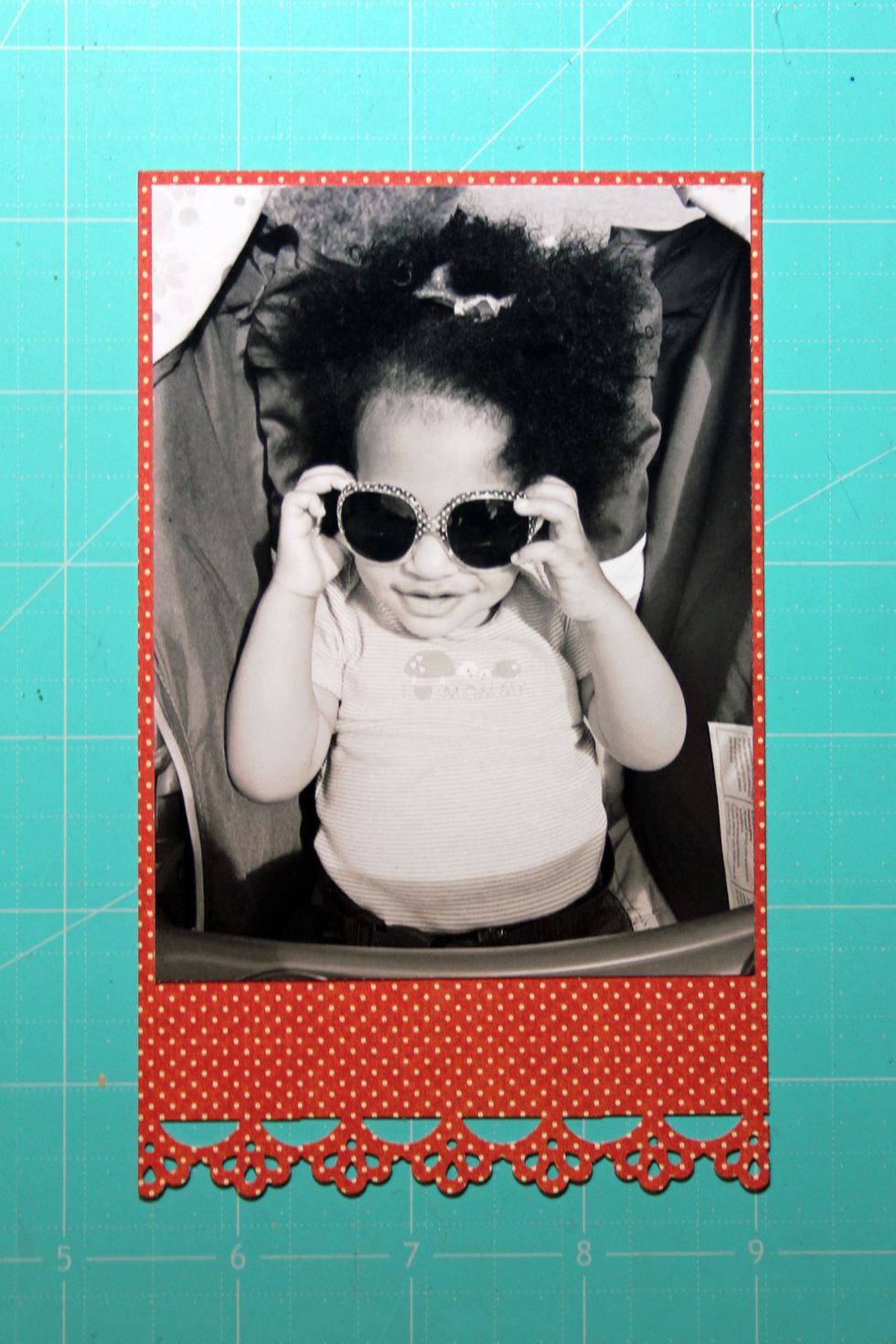 Mat photo at the top of a 3 1/2" x 4 1/2" strip cut from the Patterns and Solids pad.  Punch a floral pattern at the bottom of the mat.
