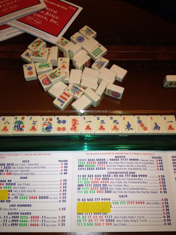 Match at least 2 of your tiles to a hand and stick with it. If deciding between two hands, choose the one you have the most tiles for and GO For IT instead of driving yourself crazy the whole game!